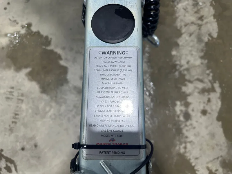 Slide: The Image of Warning label on trailer hitch with safety instructions and specifications. - 7