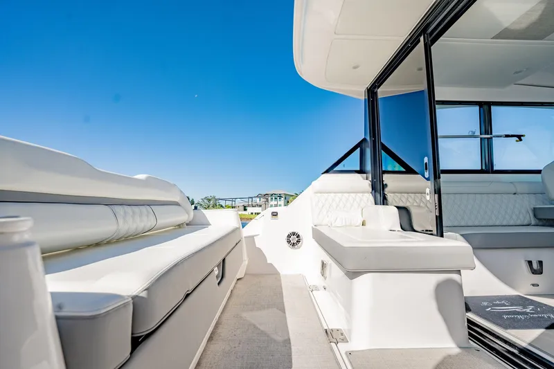 Slide: The Image of Luxurious 2022 Regal 36 XO yacht interior with sleek seating and modern design. - 20