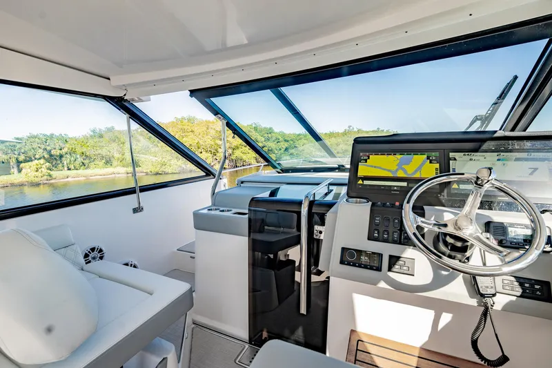 Slide: The Image of Interior view of 2022 Regal 36 XO yacht cockpit with modern navigation system. - 28