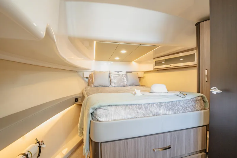 Slide: The Image of Luxurious cabin interior of 2022 Regal 36 XO yacht with cozy bed and modern design. - 40
