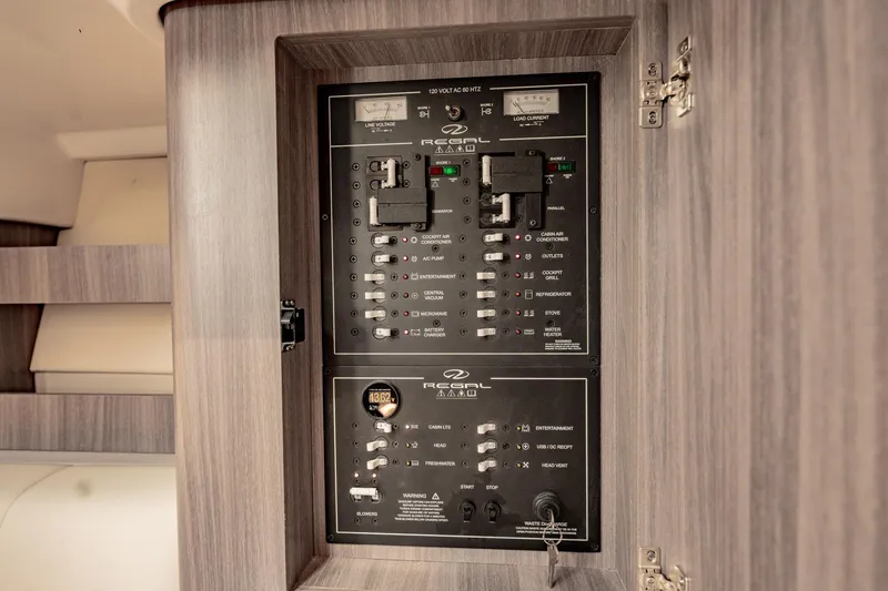 Slide: The Image of Electrical control panel of 2022 Regal 36 XO boat interior. - 46