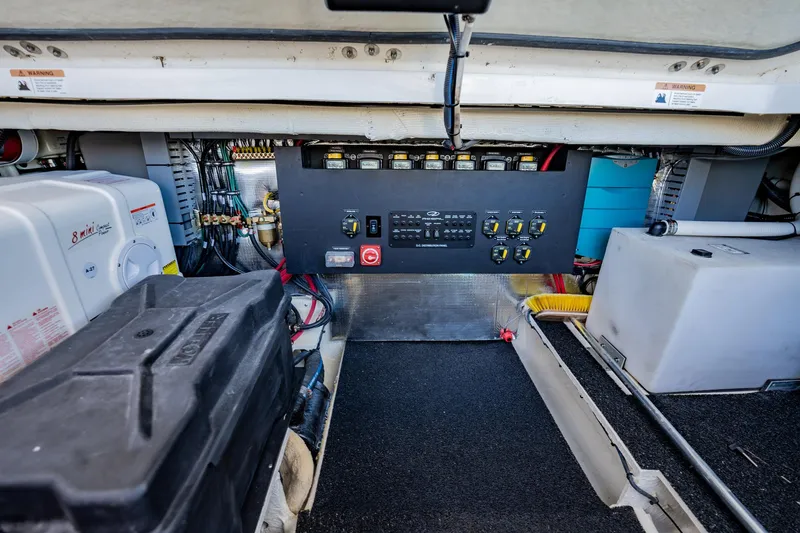 Slide: The Image of Engine room of 2022 Regal 36 XO boat with control panel and equipment. - 49