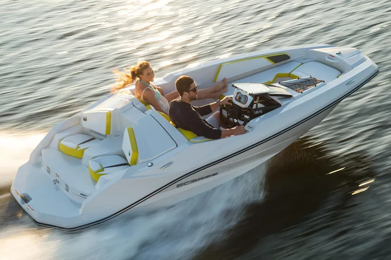 Slide: The Image of 2017 Scarab 165 G speedboat cruising on water with two passengers. - 5