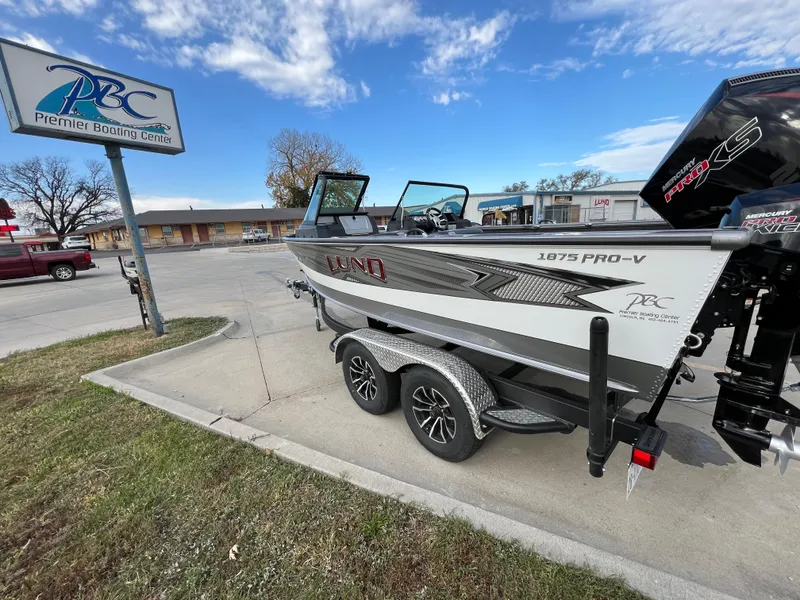 Slide: The Image of 2024 Lund 1875 Pro-V boat on trailer at Premier Boating Center. - 9