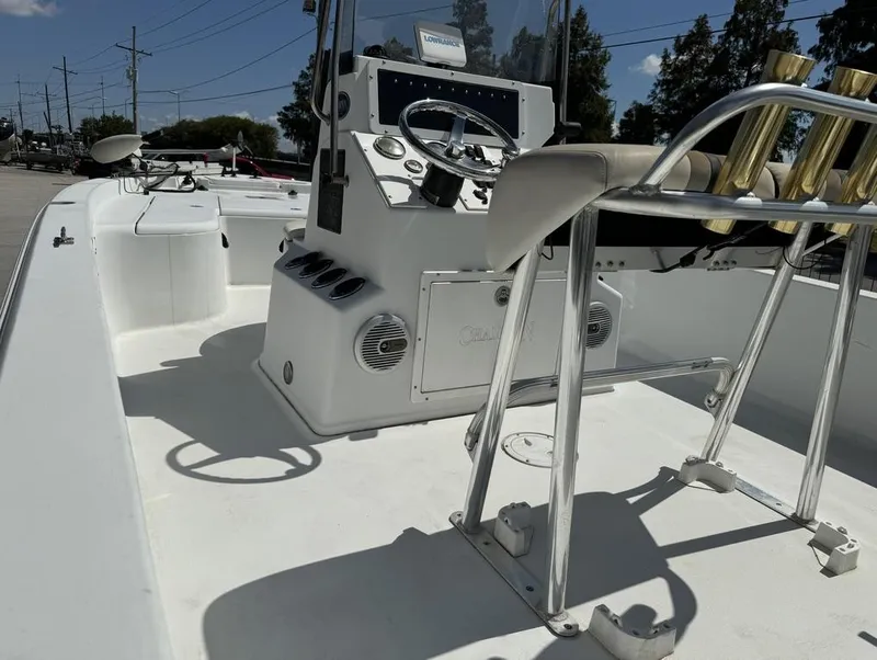 Slide: The Image of 2007 Champion 220 Bay boat interior with steering console and seating. - 12