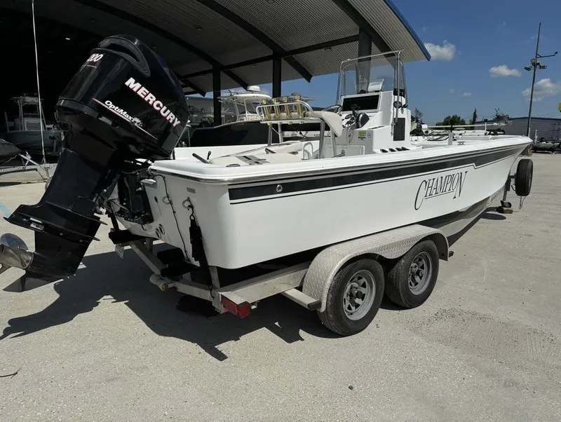 Slide: The Image of 2007 Champion 220 Bay boat with Mercury engine on trailer. - 4