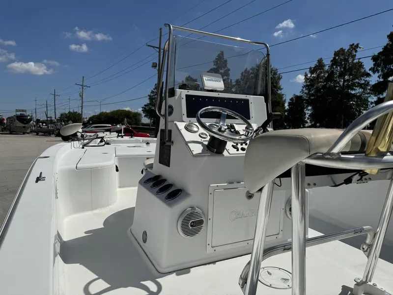 Slide: The Image of 2007 Champion 220 Bay boat interior with steering console and seating. - 6