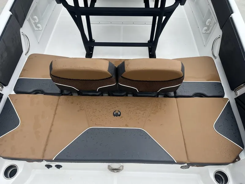 Slide: The Image of 2022 Scarab 255 Open ID boat interior with tan and gray seating. - 14
