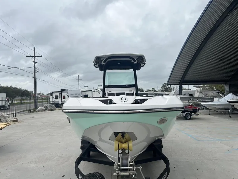 Slide: The Image of 2022 Scarab 255 Open ID boat on trailer in outdoor storage area. - 2