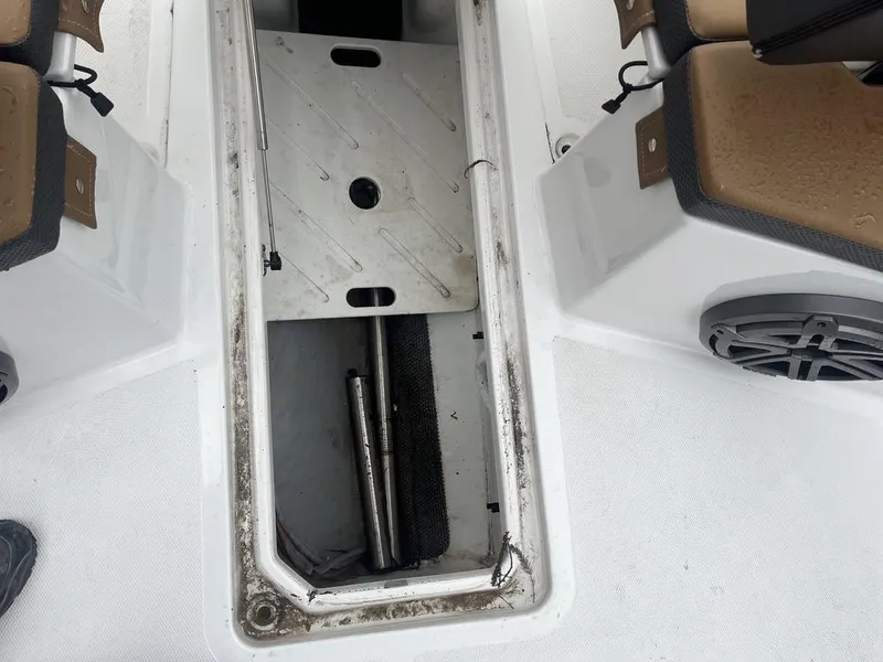 Slide: The Image of Open storage compartment on 2022 Scarab 255 Open ID boat deck. - 8