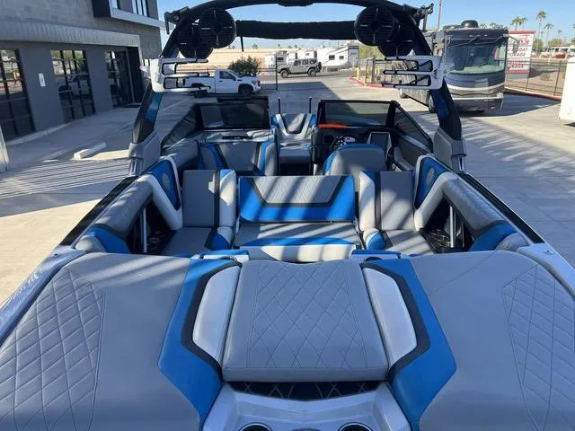 Slide: The Image of 2020 Tigé 23ZX boat interior with blue and gray seating, modern design. - 9