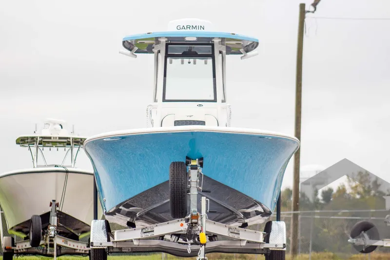 Slide: The Image of 2025 Tidewater 2500 Carolina Bay boat on trailer, front view. - 10