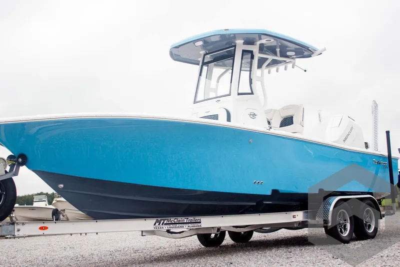 Slide: The Image of 2025 Tidewater 2500 Carolina Bay boat in vibrant blue on a trailer. - 12