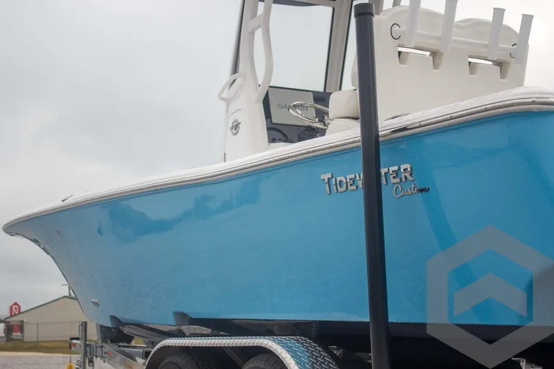 Slide: The Image of 2025 Tidewater 2500 Carolina Bay boat in vibrant blue on trailer. - 14