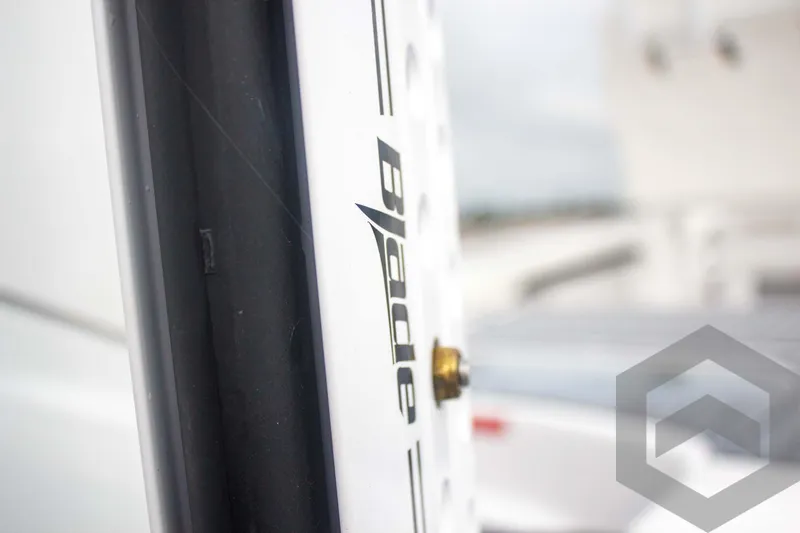 Slide: The Image of Close-up of 2025 Tidewater 2500 Carolina Bay boat detail with "Blade" logo. - 16