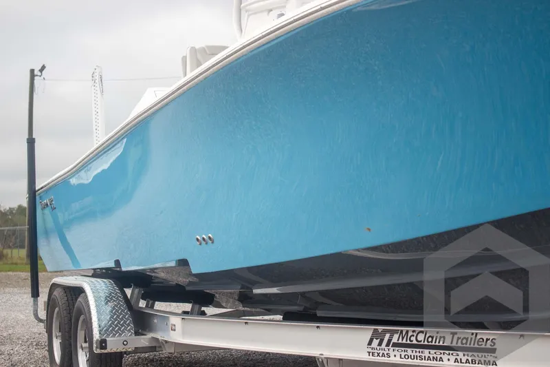 Slide: The Image of 2025 Tidewater 2500 Carolina Bay boat on McClain trailer, side view. - 19