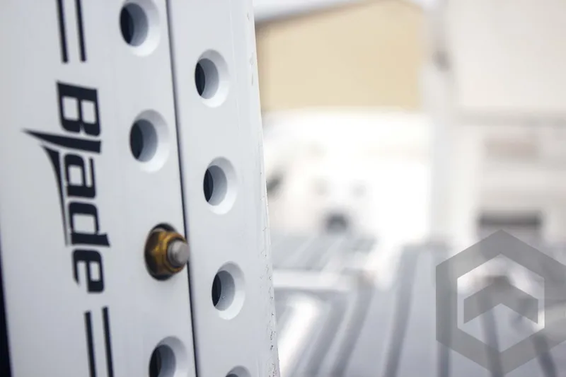 Slide: The Image of Close-up of 2025 Tidewater 2500 Carolina Bay boat detail with "Blade" branding. - 23