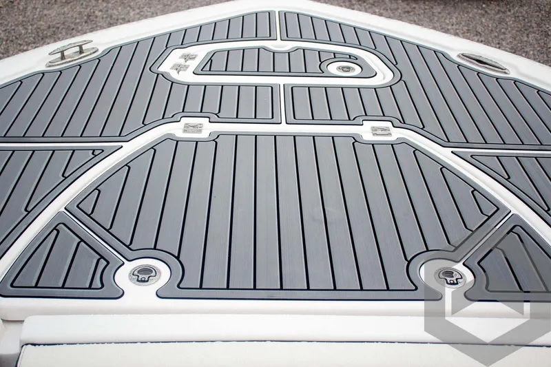 Slide: The Image of 2025 Tidewater 2500 Carolina Bay boat deck with sleek, modern design and gray non-slip surface. - 28