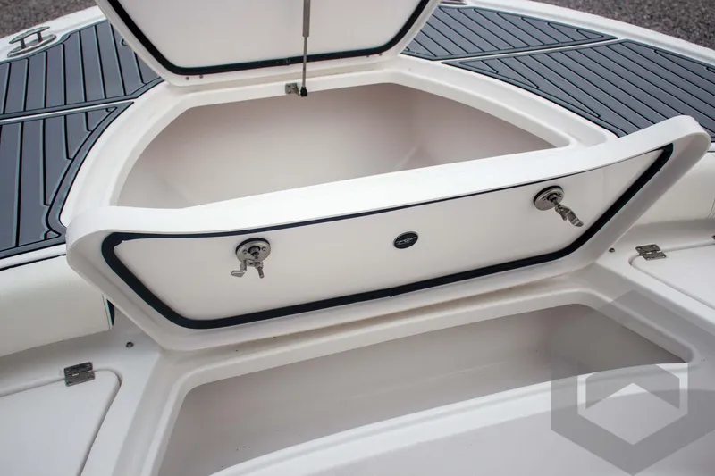 Slide: The Image of 2025 Tidewater 2500 Carolina Bay boat storage compartment with open hatch. - 31