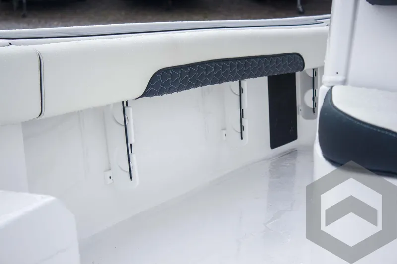 Slide: The Image of Interior view of 2025 Tidewater 2500 Carolina Bay boat, featuring sleek seating and storage. - 36