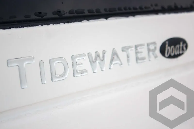Slide: The Image of Close-up of 2025 Tidewater 2500 Carolina Bay boat logo on white surface. - 38