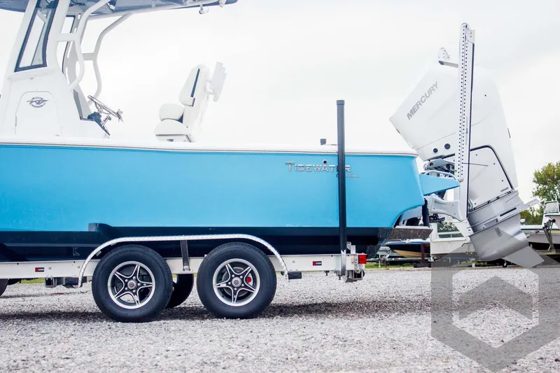 Slide: The Image of 2025 Tidewater 2500 Carolina Bay boat on trailer with Mercury outboard motor. - 4