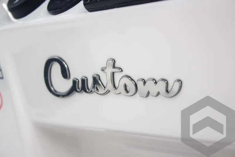 Slide: The Image of Close-up of "Custom" emblem on 2025 Tidewater 2500 Carolina Bay boat. - 46