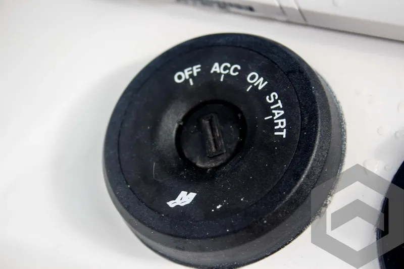 Slide: The Image of Ignition switch of 2025 Tidewater 2500 Carolina Bay boat, showing off, acc, on, start positions. - 47