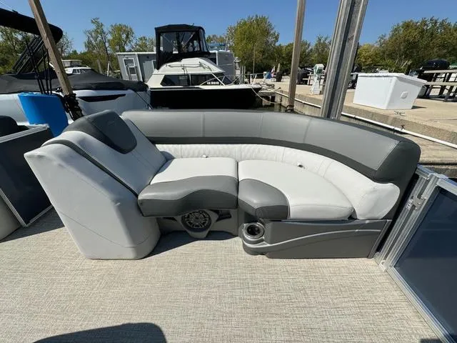 Slide: The Image of 2021 Tahoe LTZ Versatile Rear Lounger 24' with gray and white seating on a boat. - 11
