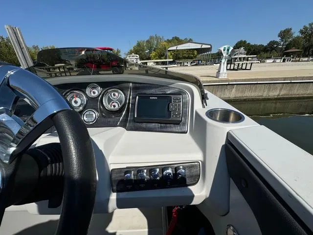 Slide: The Image of 2021 Tahoe LTZ Versatile Rear Lounger 24' boat dashboard with gauges and controls. - 12