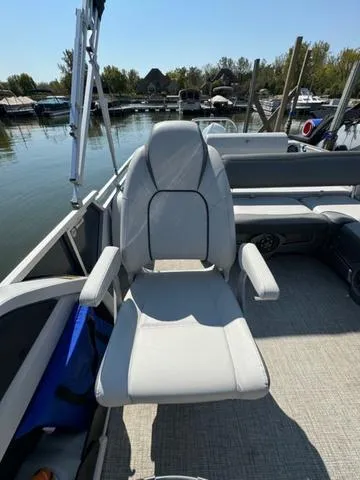 Slide: The Image of 2021 Tahoe LTZ Versatile Rear Lounger 24' boat with comfortable seating on a sunny day. - 16