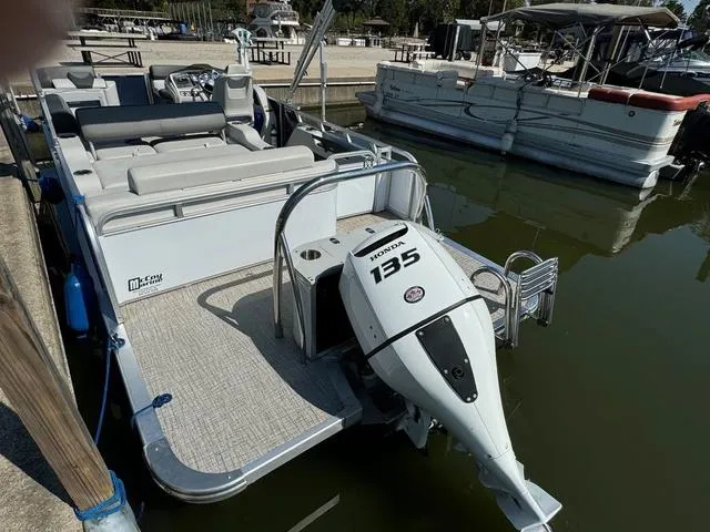 Slide: The Image of 2021 Tahoe LTZ Versatile Rear Lounger 24' boat with Honda 135 engine docked. - 4