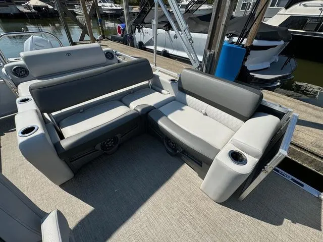 Slide: The Image of 2021 Tahoe LTZ Versatile Rear Lounger 24' boat with comfortable seating and cup holders. - 7