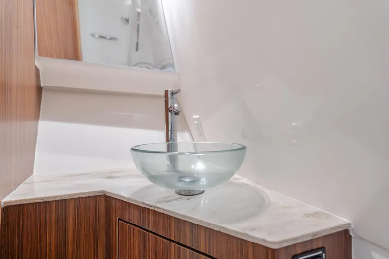 Slide: The Image of Modern glass sink in 2018 Pursuit 365 DC boat bathroom. - 26