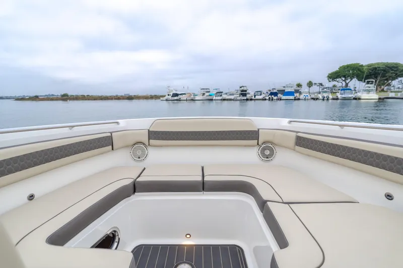 Slide: The Image of 2018 Pursuit 365 DC boat interior with spacious seating and waterfront view. - 28