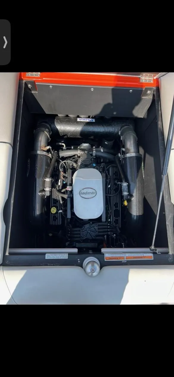 Slide: The Image of 2014 Moomba Mondo boat engine compartment with visible components. - 9