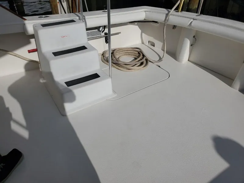Slide: The Image of 1988 Post 46 Sportfish boat deck with steps and coiled rope. - 14