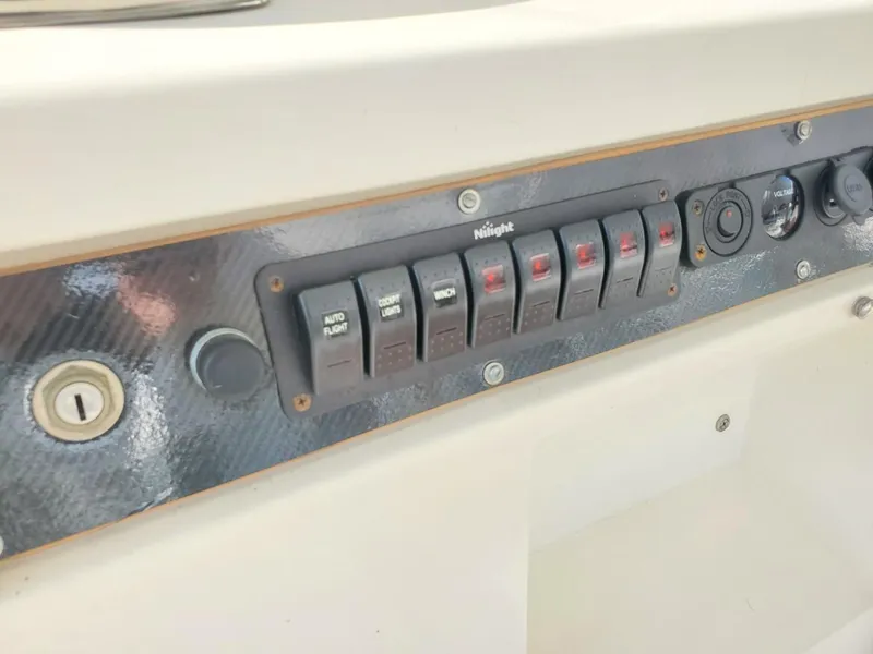 Slide: The Image of Control panel on 1988 Post 46 Sportfish boat with labeled switches. - 24