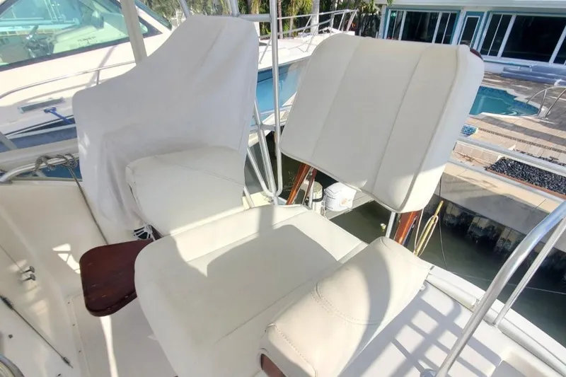 Slide: The Image of 1988 Post 46 Sportfish boat with white cushioned seats on deck. - 29