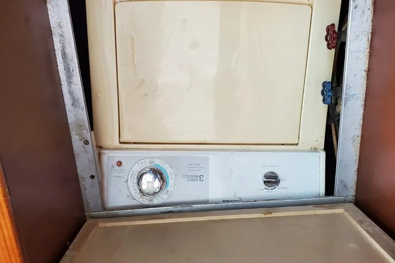 Slide: The Image of Vintage washer-dryer unit inside 1988 Post 46 Sportfish boat. - 49