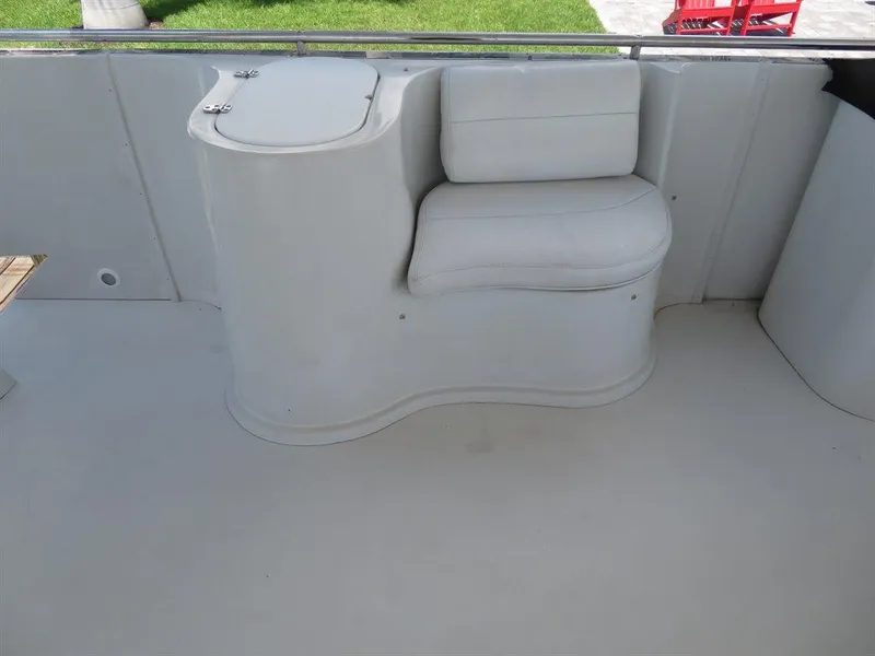Slide: The Image of Bluewater Yachts Millennium Series 63, 2000 model, featuring a sleek white seating area. - 10