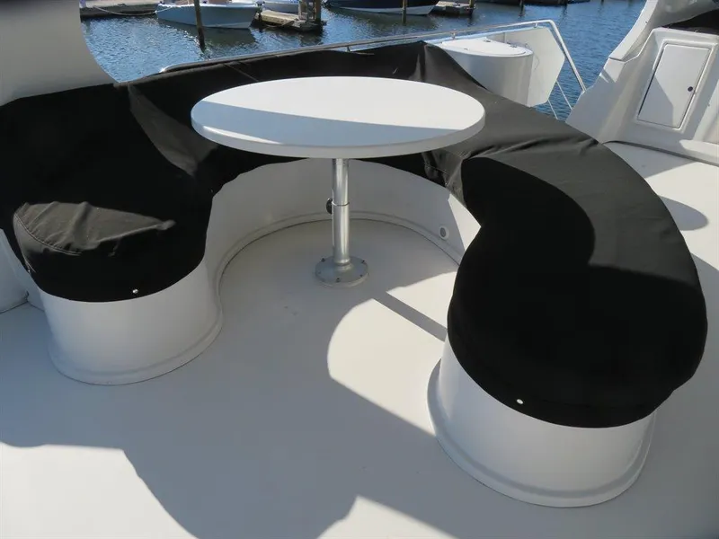 Slide: The Image of Curved seating with table on 2000 Bluewater Yachts Millennium Series 63. - 12