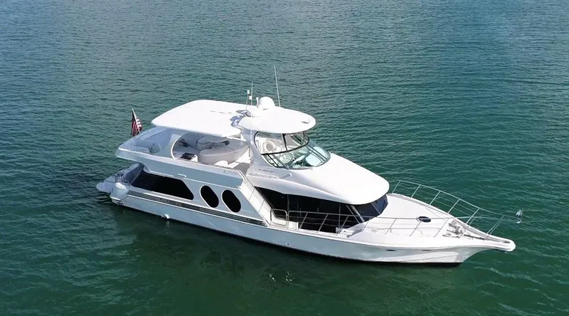 Slide: The Image of 2000 Bluewater Yachts Millennium Series 63 cruising on calm waters. - 2