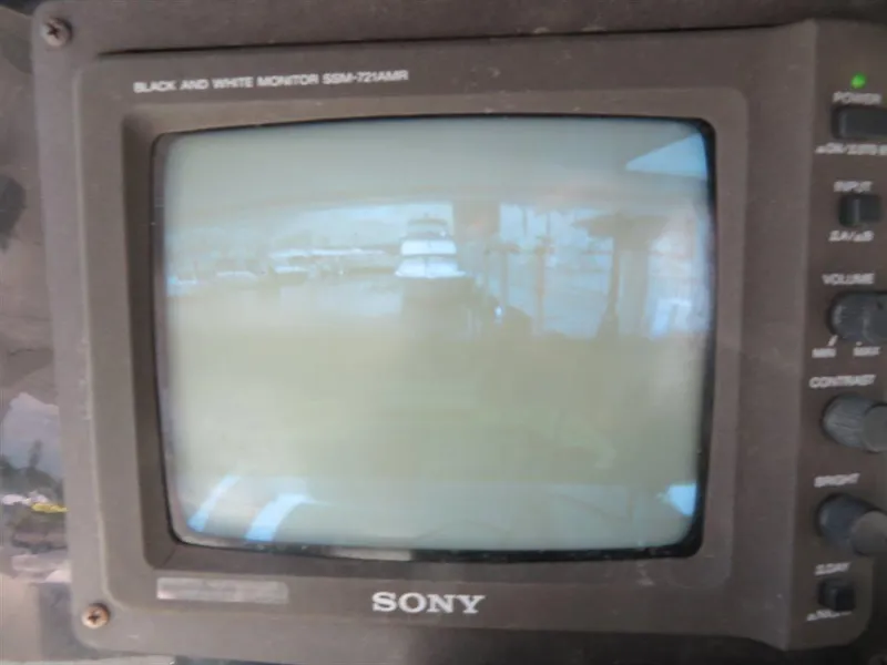 Slide: The Image of Sony black and white monitor displaying a marina view, associated with Bluewater Yachts Millennium Series 63. - 25