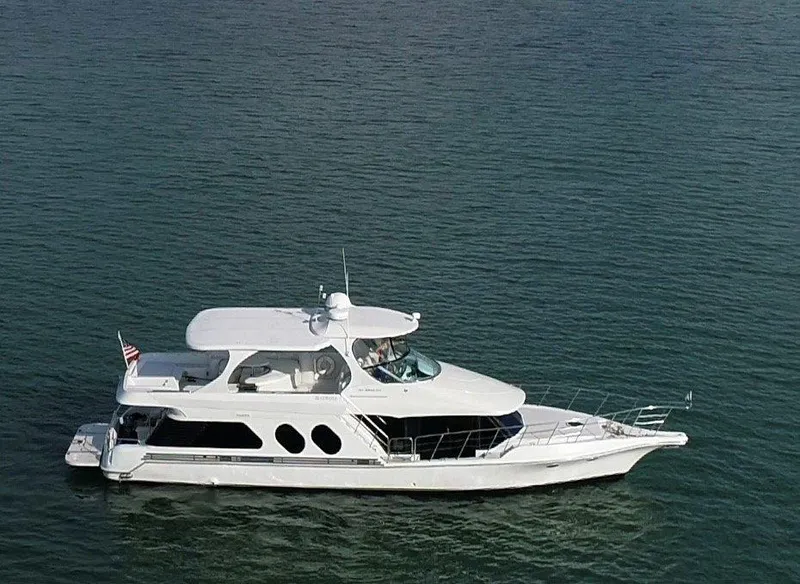 Slide: The Image of 2000 Bluewater Yachts Millennium Series 63 cruising on calm waters. - 3