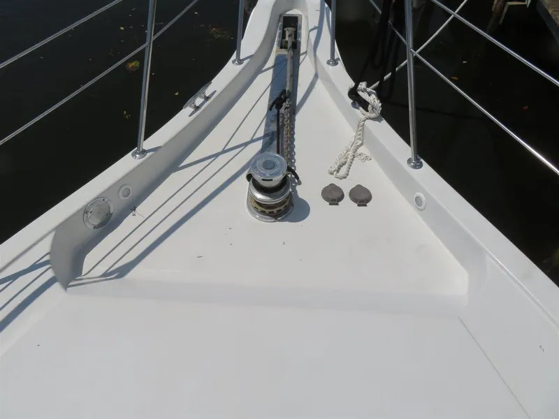 Slide: The Image of Bow of 2000 Bluewater Yachts Millennium Series 63 with anchor winch. - 31