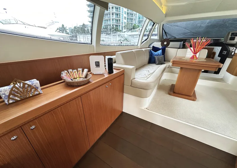 Slide: The Image of Luxurious interior of 2014 Ferretti Yachts 530 with elegant seating and wooden cabinetry. - 12