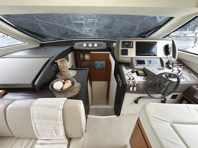 Slide: The Image of Interior of 2014 Ferretti Yachts 530, featuring modern helm and luxurious seating. - 18