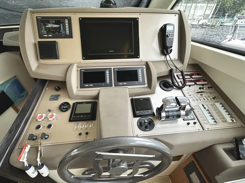 Slide: The Image of Control panel of 2014 Ferretti Yachts 530 with steering wheel and navigation equipment. - 20