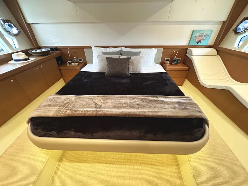 Slide: The Image of Luxurious bedroom interior of 2014 Ferretti Yachts 530 with elegant furnishings. - 27